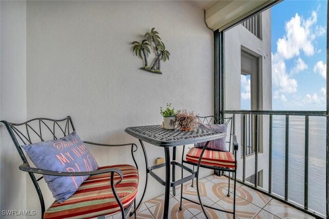 balcony featuring a water view