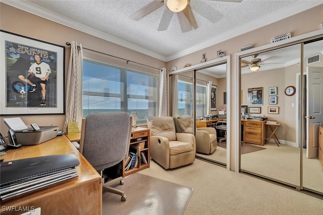 home office with ceiling fan, carpet, and a textured ceiling