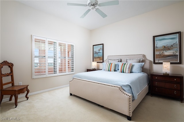 bedroom featuring ceiling fan and light carpet