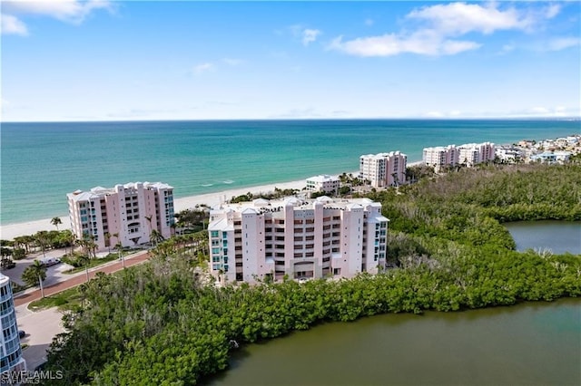 bird's eye view with a view of the beach and a water view