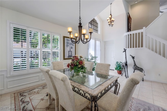 tiled dining space with an inviting chandelier