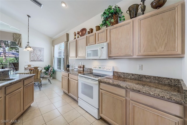 kitchen featuring white appliances, vaulted ceiling, decorative light fixtures, and light brown cabinets