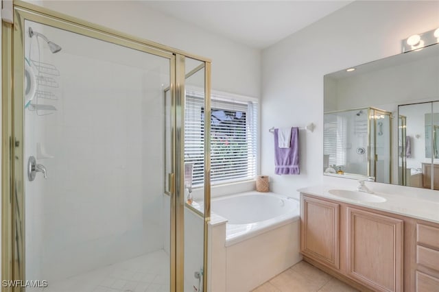 bathroom featuring vanity, tile patterned floors, and separate shower and tub