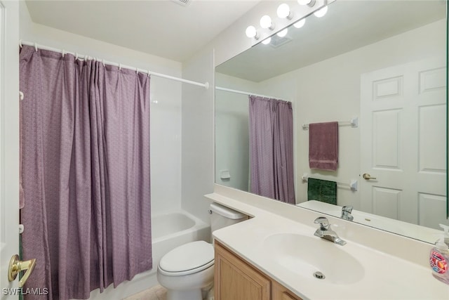 full bathroom featuring vanity, shower / tub combo, and toilet