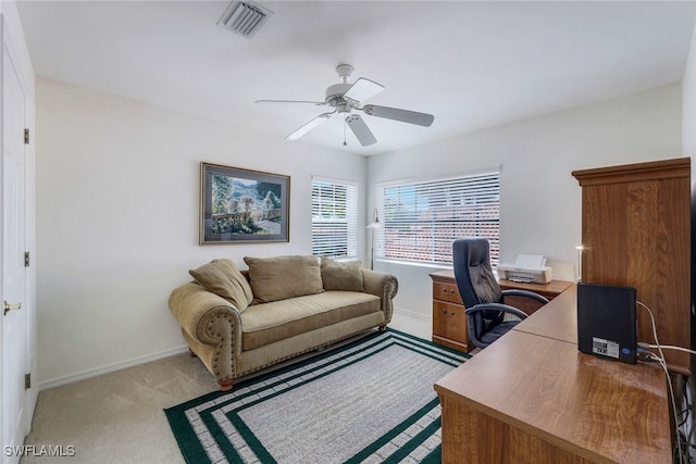 office featuring light carpet and ceiling fan