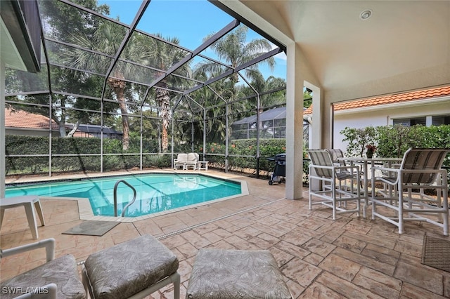 view of pool featuring a lanai and a patio area