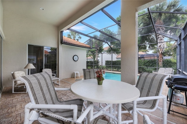 view of patio / terrace featuring glass enclosure