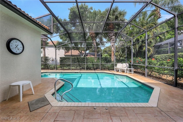 view of pool with a lanai and a patio