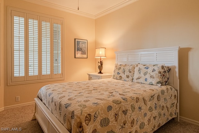 carpeted bedroom featuring crown molding