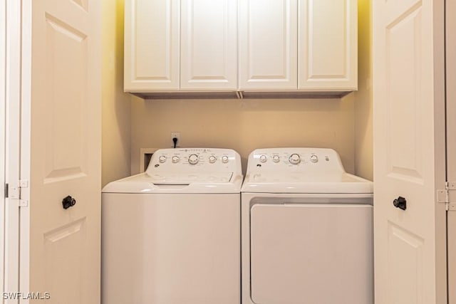 17100 Bridgestone Ct Unit 205, Fort Myers, FL 33908 - laundry room featuring washer and dryer and cabinet space