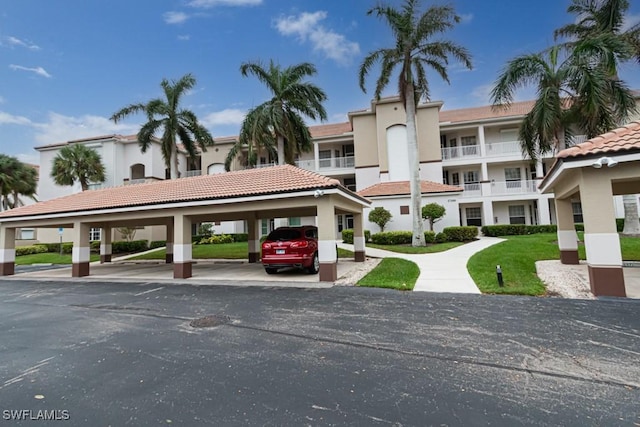 17100 Bridgestone Ct Unit 205, Fort Myers, FL 33908 - view of property featuring covered parking