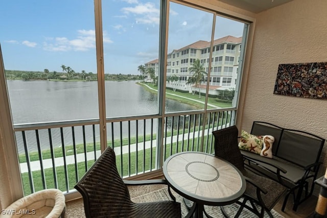 17100 Bridgestone Ct Unit 205, Fort Myers, FL 33908 - sunroom featuring plenty of natural light and a water view