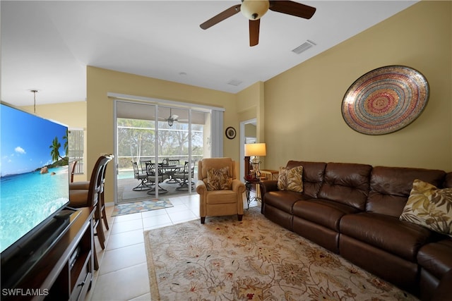 tiled living room featuring ceiling fan