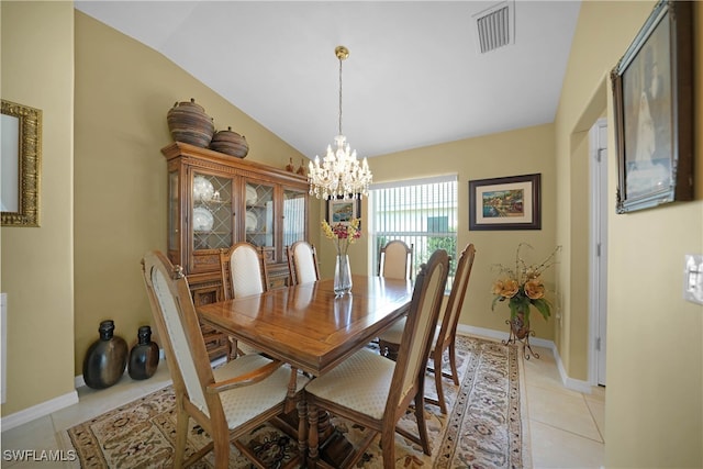 dining room featuring light tile patterned floors, an inviting chandelier, and lofted ceiling