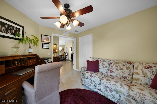 living room featuring ceiling fan and light tile patterned floors