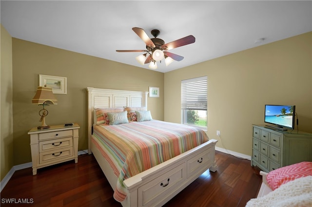 bedroom featuring dark hardwood / wood-style flooring and ceiling fan