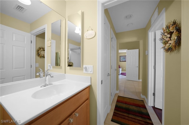 bathroom featuring vanity and tile patterned flooring