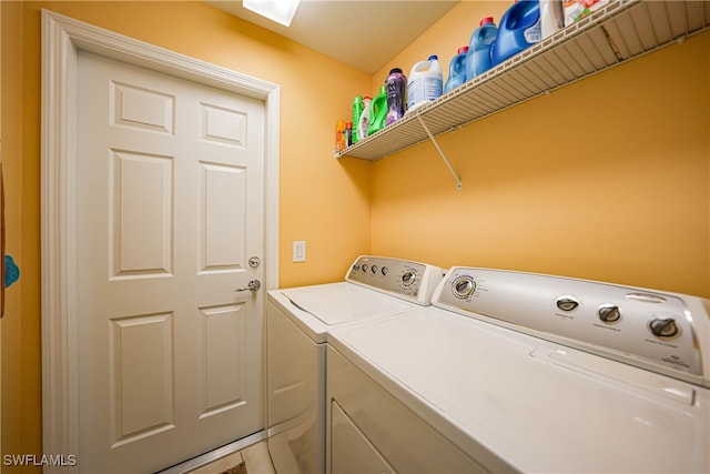 laundry area featuring washing machine and clothes dryer