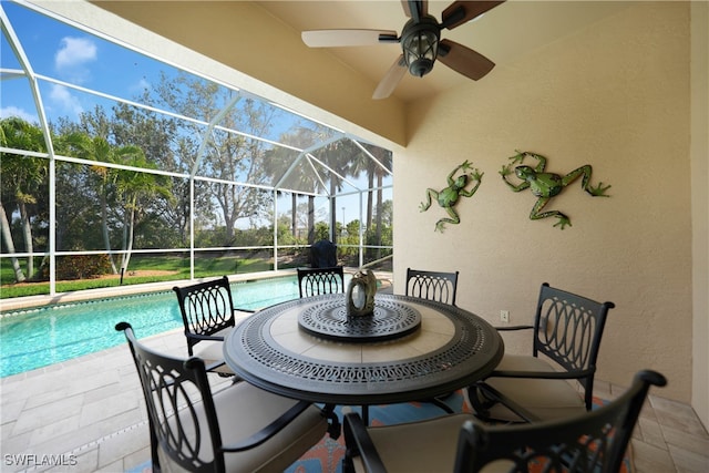 view of patio / terrace with glass enclosure and ceiling fan