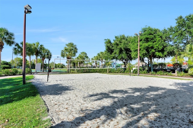 view of community with a yard and volleyball court