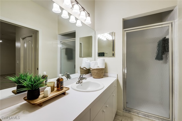 full bath featuring a stall shower and vanity