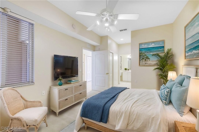 bedroom with ceiling fan, visible vents, and connected bathroom