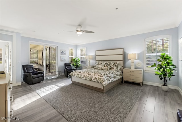 bedroom featuring access to outside, crown molding, ceiling fan, and light hardwood / wood-style floors