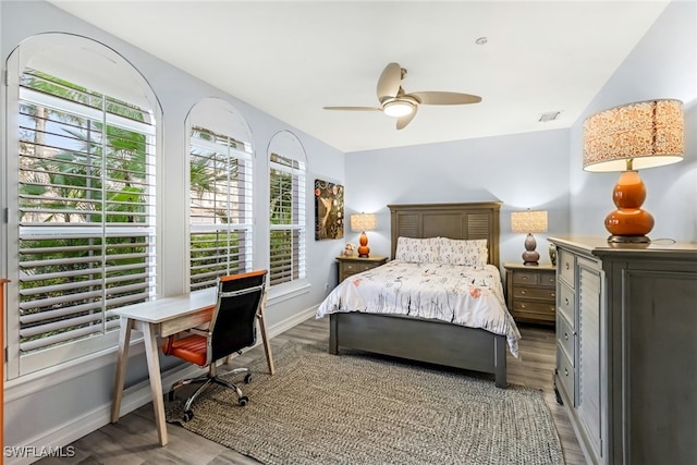 bedroom with hardwood / wood-style flooring and ceiling fan