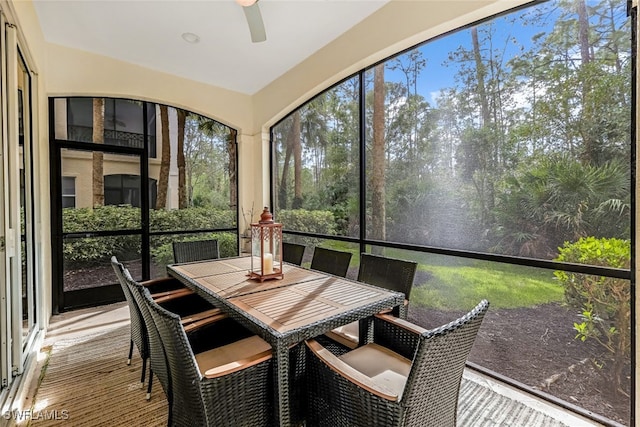 sunroom featuring ceiling fan