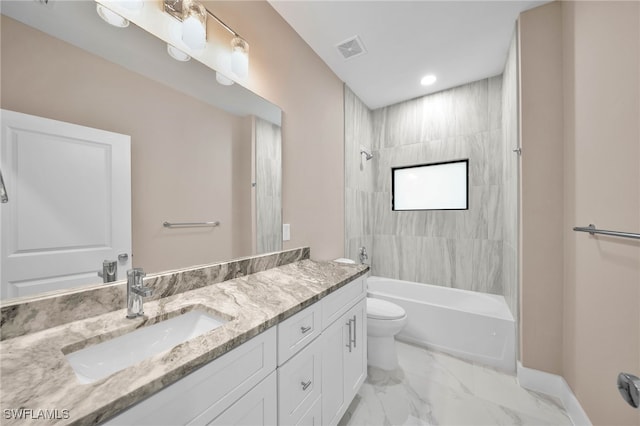 full bathroom with vanity, tiled shower / bath, and toilet