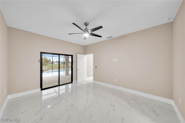 unfurnished room with ceiling fan