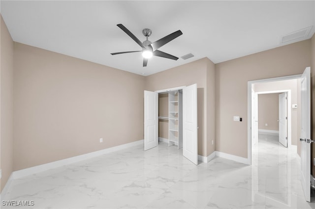 unfurnished bedroom with ceiling fan and a closet