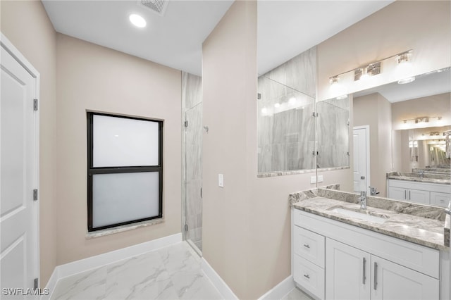 bathroom with vanity and an enclosed shower