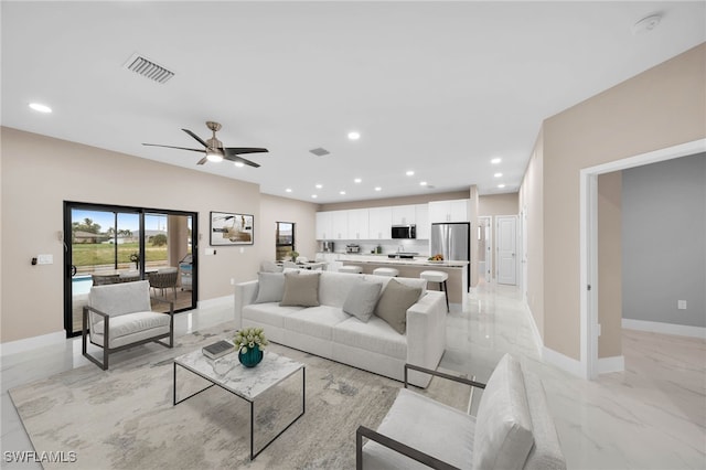 living room featuring ceiling fan