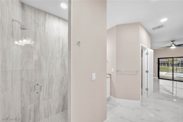 bathroom with vanity, an enclosed shower, and ceiling fan