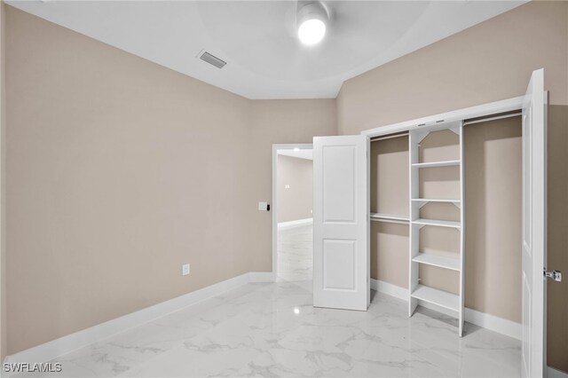 unfurnished bedroom with a closet