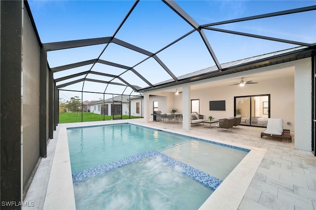 view of swimming pool with a lanai, ceiling fan, an outdoor living space, and a patio area