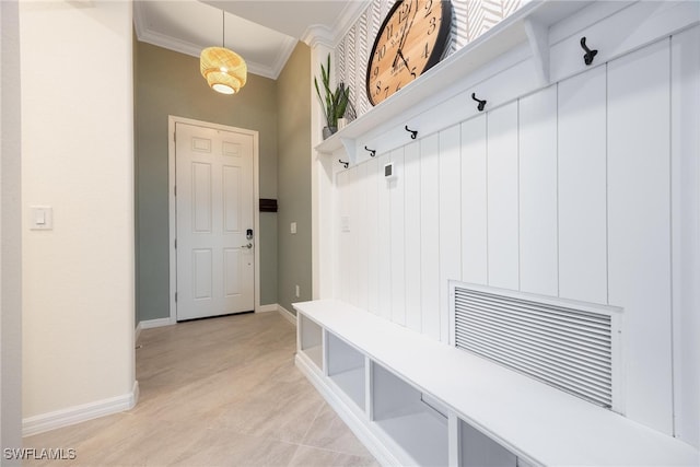 mudroom featuring crown molding