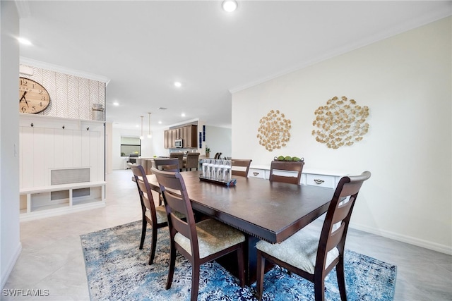 dining area featuring crown molding