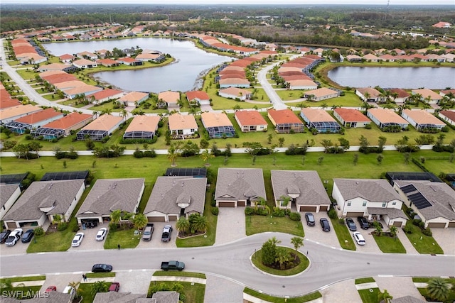 bird's eye view with a water view