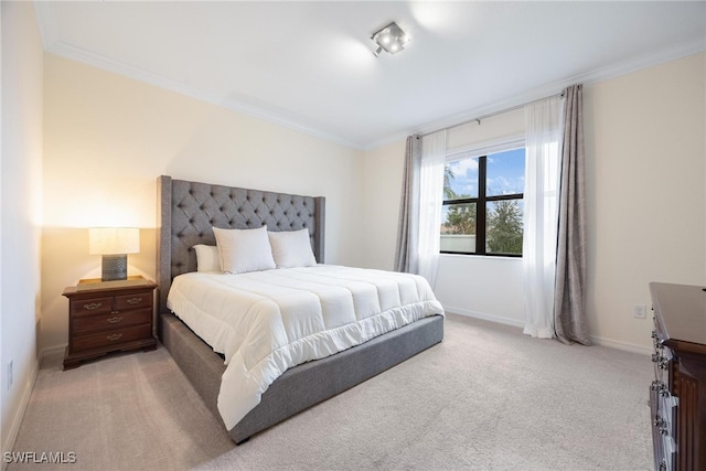 carpeted bedroom featuring crown molding