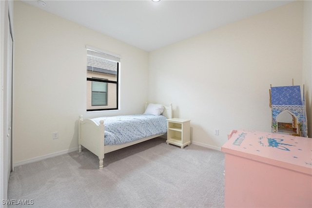 bedroom with light colored carpet