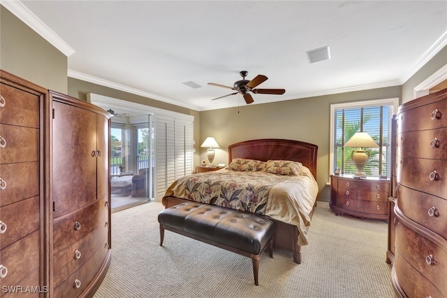 carpeted bedroom featuring access to outside, multiple windows, ceiling fan, and ornamental molding