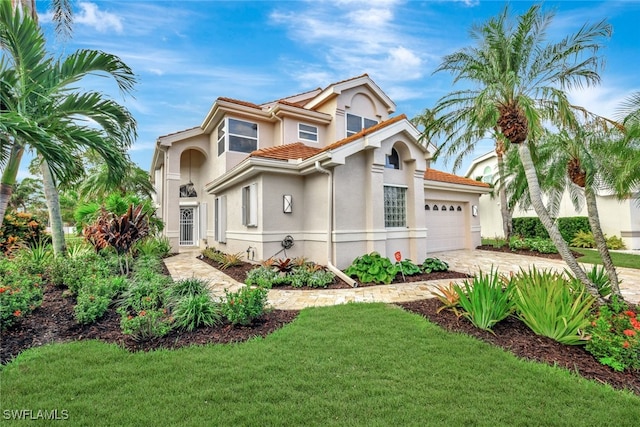 view of front facade with a front lawn and a garage