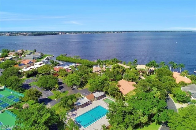 birds eye view of property with a water view