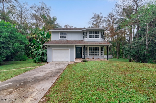 front of property with a garage, a porch, and a front lawn