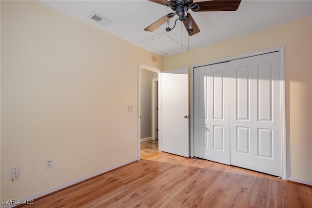 unfurnished bedroom with a closet, ceiling fan, and light hardwood / wood-style flooring