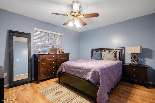 bedroom featuring ceiling fan and light hardwood / wood-style flooring