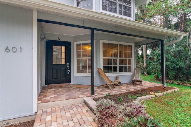 property entrance with covered porch