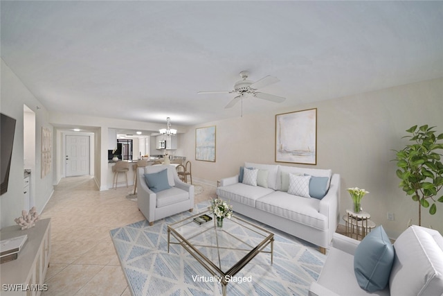 living room with light tile patterned floors and ceiling fan with notable chandelier